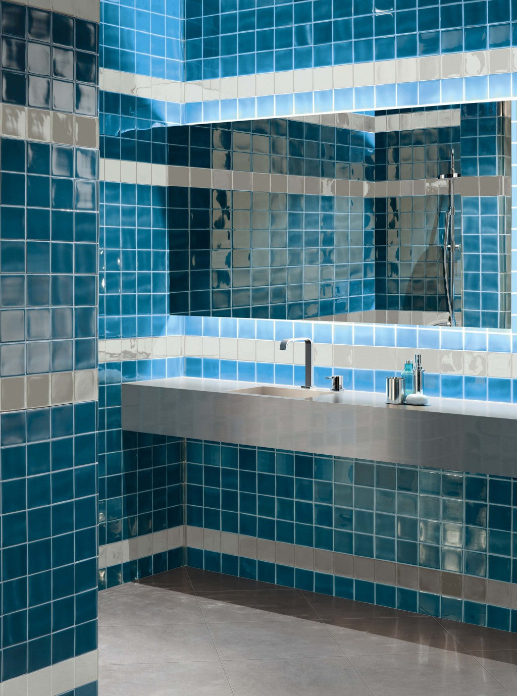 Stonington Petrol Blue gloss ceramic 70x140mm tiles on a wall