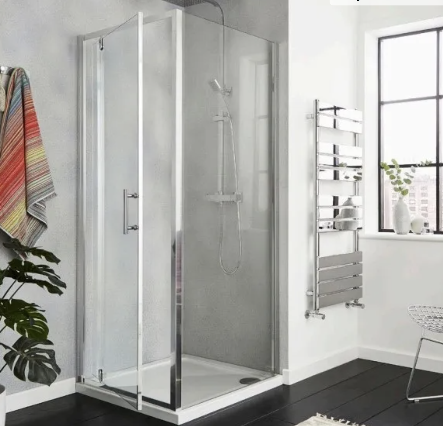 Kartell K-VIT KV8 frameless side panel fitted to a corner shower