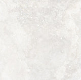 Charleston white travertine-effect matt porcelain 600x600mm tile on a bathroom wall