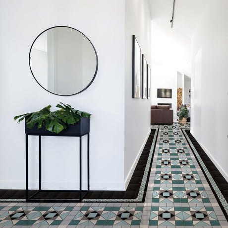 Edisto emerald green Victorian pattern matt porcelain floor tile 338x338mm laid in a hallway