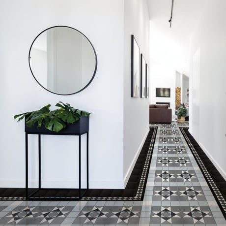 Edisto Victorian border laid round a patterned hallway floor