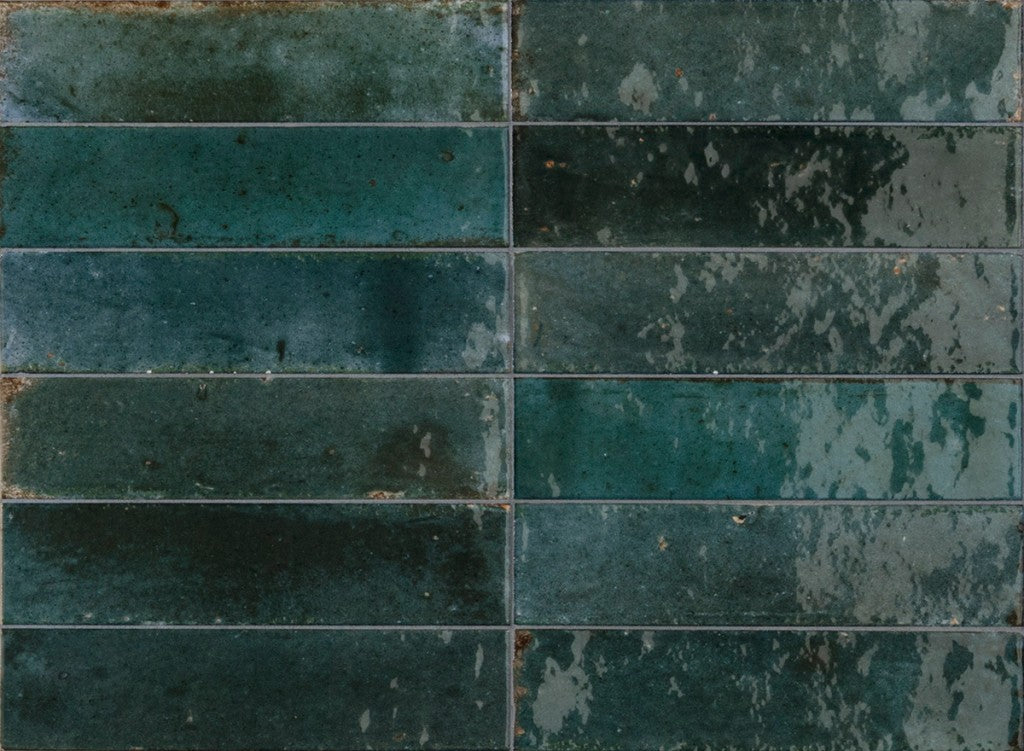 Montauk blue gloss porcelain brick tile 240x60mm on a bathroom wall