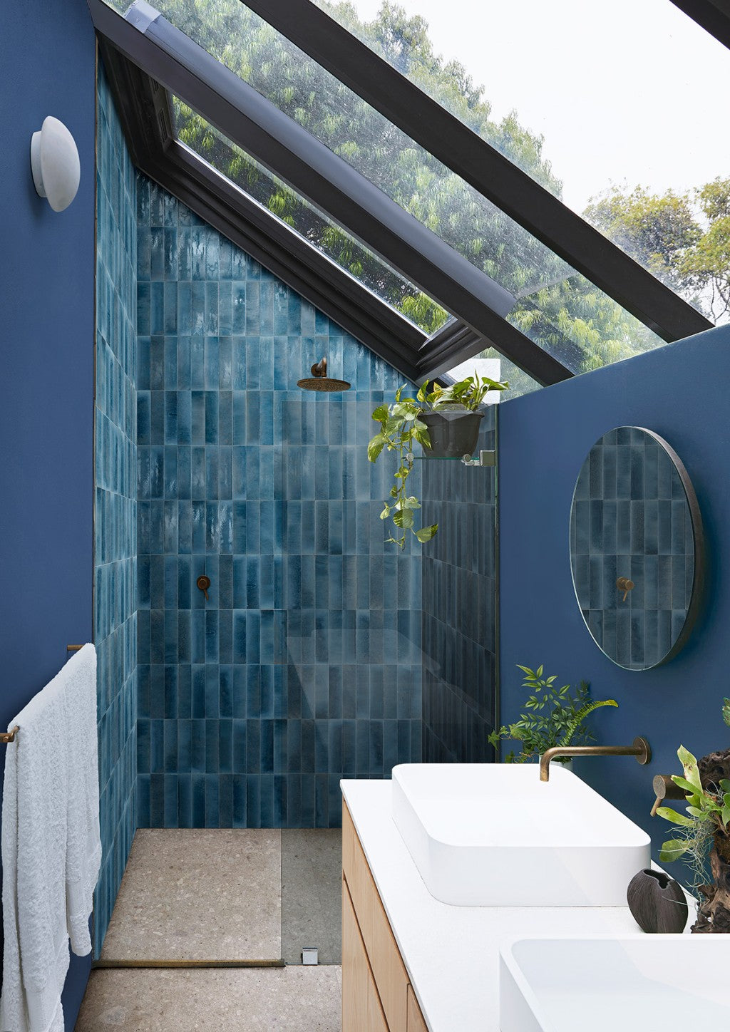 Montauk china blue gloss porcelain brick tile 240x60mm on a wall