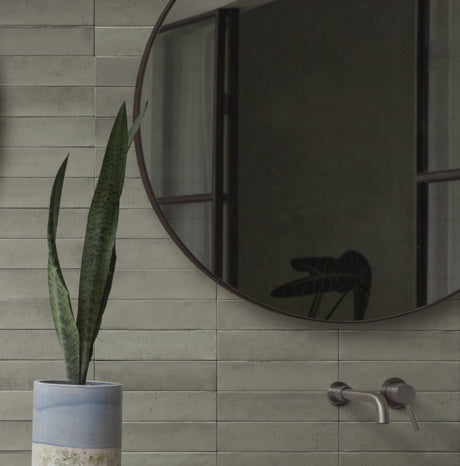 Montauk off-white gloss porcelain brick tile 240x60mm on a wall