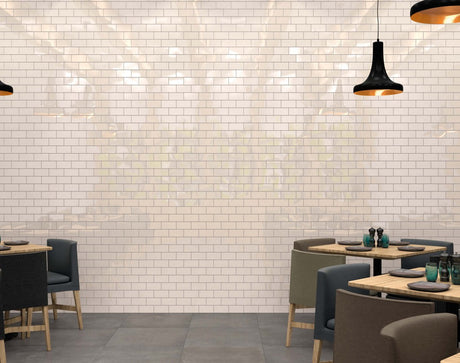Stonington White gloss ceramic 70x140mm tiles laid on a wall